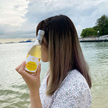 Load image into Gallery viewer, Sachi Soy Wine Yuzu and Bergamot in a beach